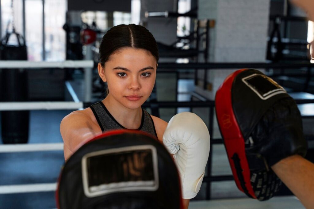medium-shot-girl-learning-boxing_23-2150399961