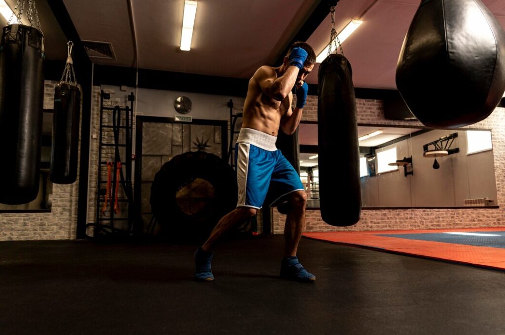 side-view-shirtless-male-boxer-training_23-2148615065